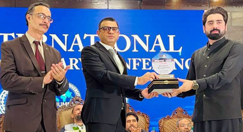 Special Assistant to Chief Minister for Science and Information Technology Dr. Shafqat Ayaz, is Being presented a shield by the Vice Chancellor of Iqra National University on the Occasion of the second International Multidisciplinary Conference.